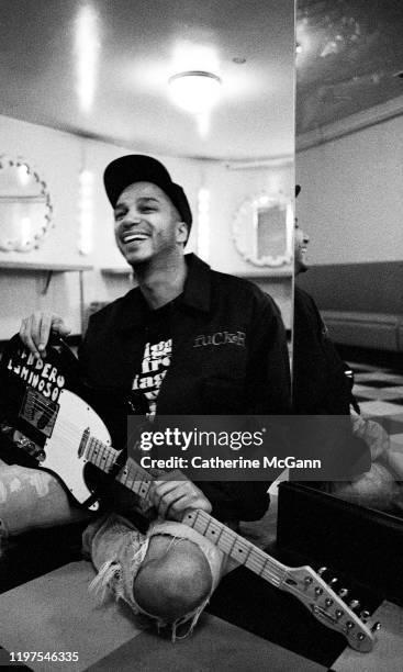 American rock guitarist Tom Morello, of bands Rage Against the Machine and Audioslave poses for a portrait holding his guitar in March 1993 in New...