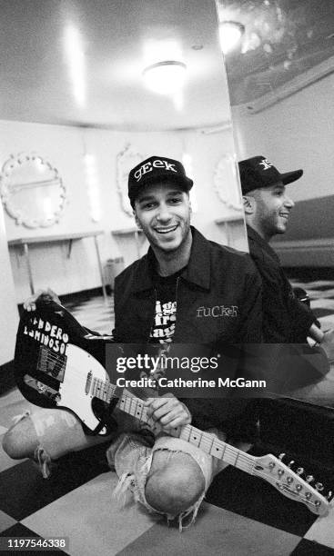 American rock guitarist Tom Morello, of bands Rage Against the Machine and Audioslave poses for a portrait holding his guitar in March 1993 in New...