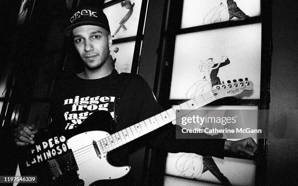 American rock guitarist Tom Morello, of bands Rage Against the Machine and Audioslave poses for a portrait holding his guitar in March 1993 in New...