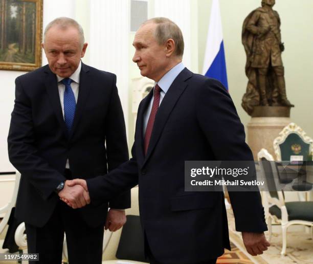 Russian President Vladimir Putin greets Deputy Defence Minister Alexander Fomin during their meeting at the Kremlin on January 30, 2020 in Moscow,...