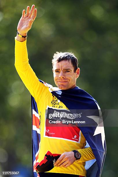 Cadel Evans of team BMC celebrates on the podium after winning the 2011 Tour de France after the twenty first and final stage of Le Tour de France...