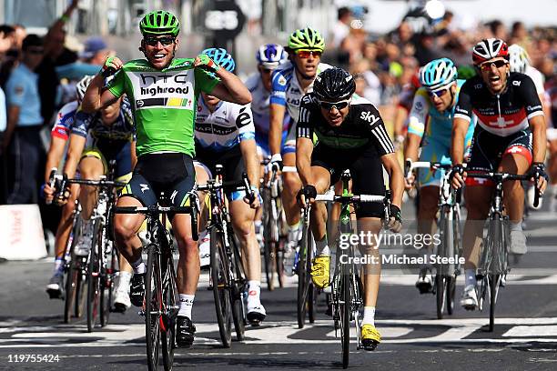Mark Cavendish of team HTC wins the final sprint and the green points jersey during the twenty first and final stage of Le Tour de France 2011, from...