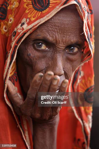 Somali refugee waits at the entrance to the registration area of the IFO refugee camp which makes up part of the giant Dadaab refugee settlement on...