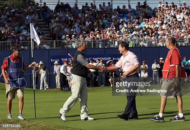 John Cook of the USA and Tom Watson of the USA shake hands on the 18th green during the final round of the Senior Open Championship at Walton Heath...