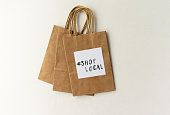 #ShopLocal stamped on a paper bag - shop local message for small retailers / businesses