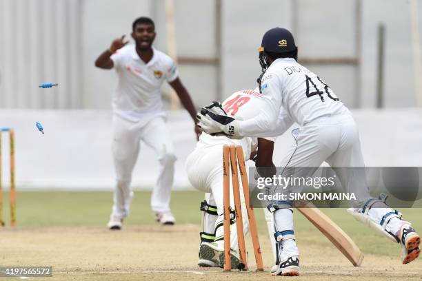 Zimbabwe's Timycen Maruma is stumped out by Sri Lanka's Niroshan Dickwella from a ball delivered by Sri Lanka's Lasith Embuldeniya during the fourth...