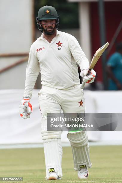Zimbabwe's Brendan Taylor celebrates after scoring a half-century during the fourth day of the second Test cricket match between Zimbabwe and Sri...