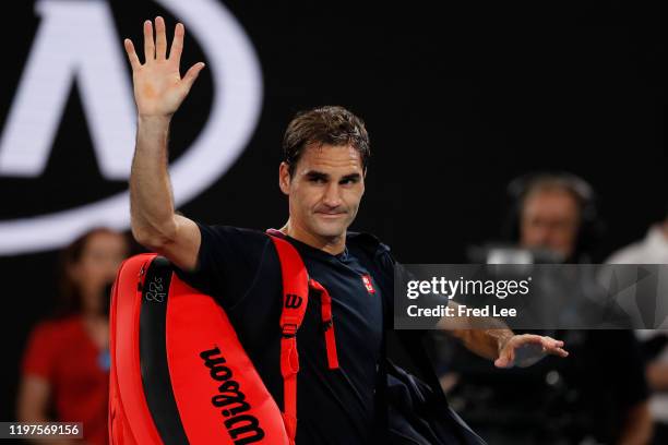 Roger Federer of Switzerland acknowledges the crowd as he walks off court after losing his Men's Singles Semifinal match against Novak Djokovic of...