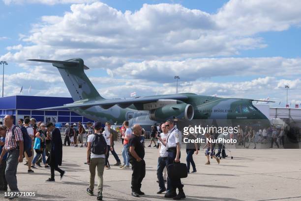 Crowd of visitors at the tarmac of Le Bourget Airport during Paris Air Show 2019 and the Brazilian Air Force Embraer KC-390 renamed after Boeing and...