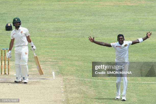 Sri Lanka's Vishwa Fernando celebrates after the dismissal of Zimbabwe's Sikandar Raza during the fourth day of the second Test cricket match between...