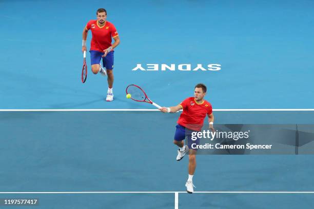 Radu Albot and Alexander Cozbinov of Moldova play a shot during their Group C doubles match against Grigor Dimitrov and Alexander Lazarov of Bulgaria...