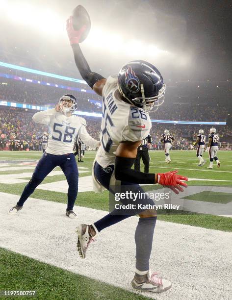 Logan Ryan of the Tennessee Titans celebrates his touchdown against the New England Patriots in the AFC Wild Card Playoff game at Gillette Stadium on...