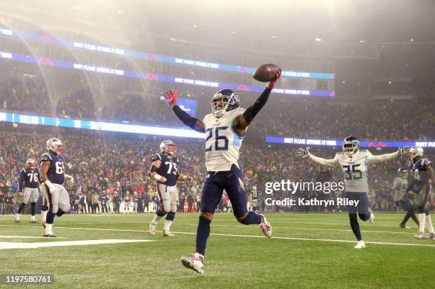 Logan Ryan of the Tennessee Titans celebrates his touchdown against the New England Patriots in the fourth quarter of the AFC Wild Card Playoff game...