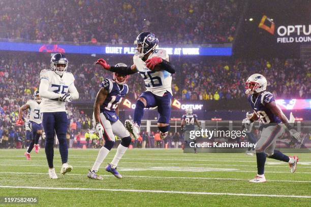 Logan Ryan of the Tennessee Titans carries the ball to score a touchdown against the New England Patriots in the fourth quarter of the AFC Wild Card...