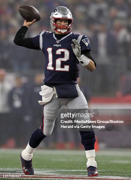 Tom Brady of the New England Patriots throws during the second quarter of the Wild Card game against the Tennessee Titans at Gillette Stadium on...