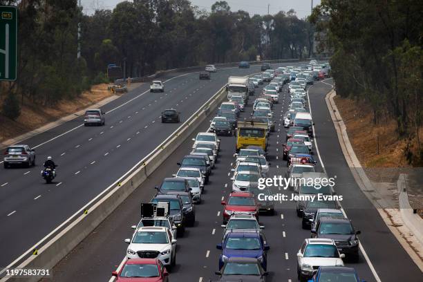 Traffic is seen at a standstill on the M5 motorway westbound, due to a fire on January 05, 2020 in Sydney, Australia. One person has died overnight...