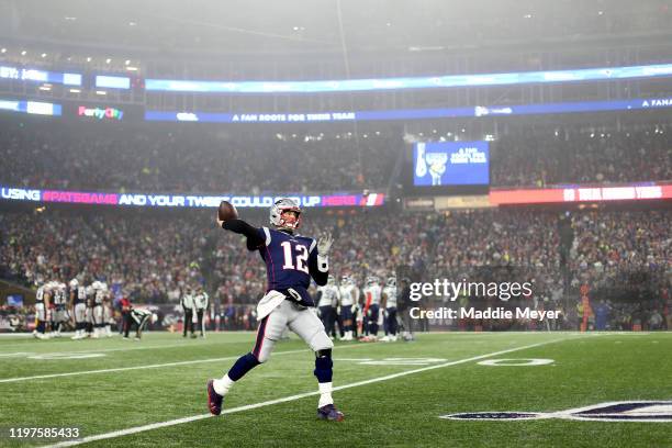 Tom Brady of the New England Patriots throws a pass against the Tennessee Titans in the AFC Wild Card Playoff game at Gillette Stadium on January 04,...