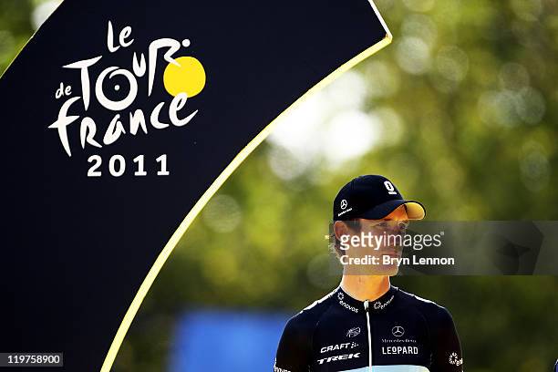 Runner up Andy Schleck of team Leopard Trek looks on from the podium after the twenty first and final stage of Le Tour de France 2011, from Creteil...