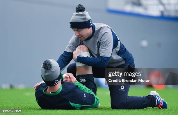 Dublin , Ireland - 30 January 2020; Jonathan Sexton with team physio Colm Fuller during Ireland Rugby squad training at the IRFU High Performance...