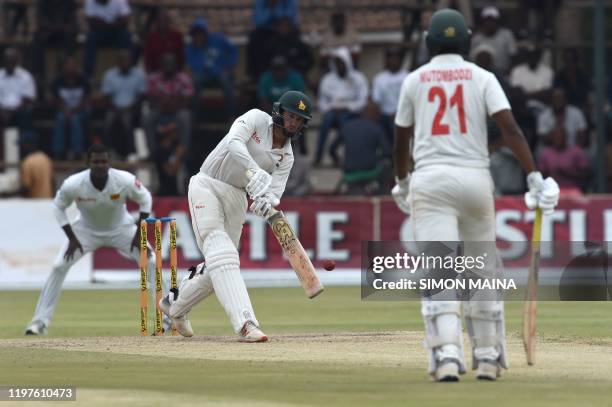 Zimbabwe's captain Sean Williams plays a shot during the fourth day of the second Test cricket match between Zimbabwe and Sri Lanka at the Harare...