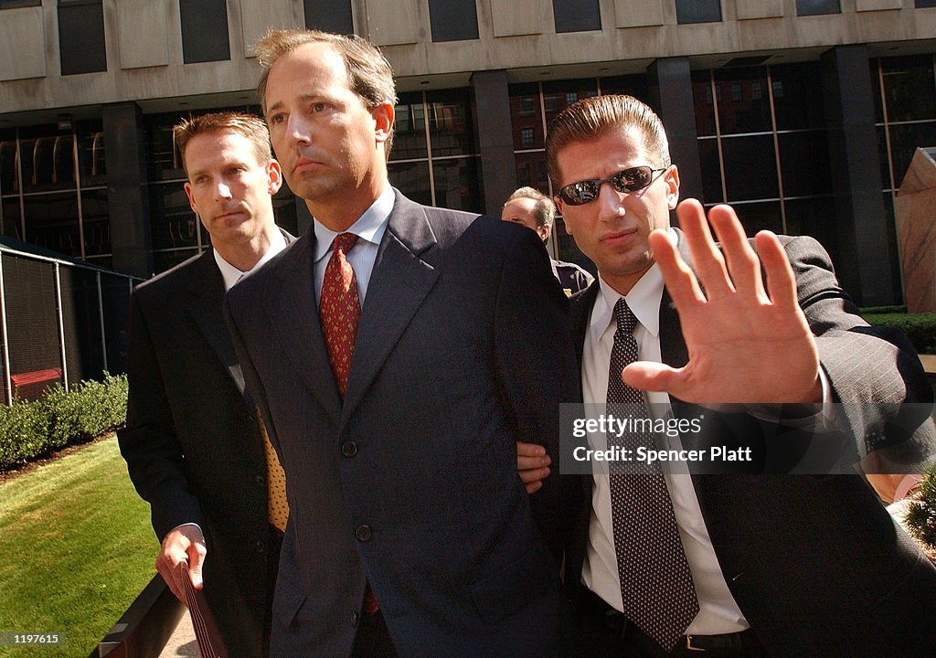 Federal agents lead former WorldCom controller David Myers from... News ...