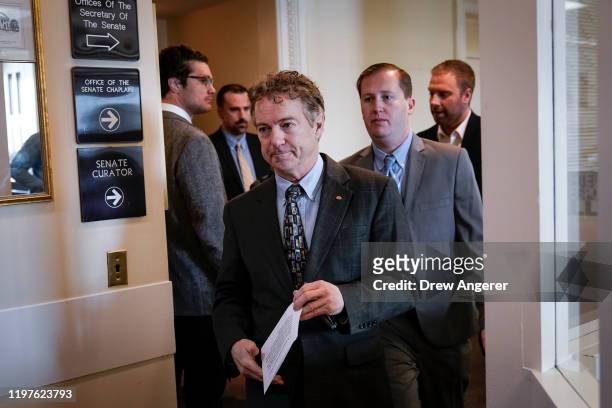 After Chief Justice John Roberts did not read his question aloud, Sen. Rand Paul leaves a brief news conference during the Senate impeachment trial...