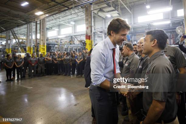 Justin Trudeau, Canada's prime minister, greets employees during an event at the ABC Technologies Inc. Facility in Brampton, Ontario, Canada, on...