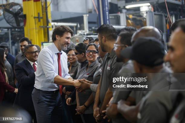 Justin Trudeau, Canada's prime minister, greets employees during an event at the ABC Technologies Inc. Facility in Brampton, Ontario, Canada, on...