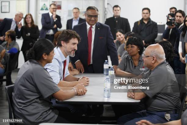 Justin Trudeau, Canada's prime minister, speaks with employees during an event at the ABC Technologies Inc. Facility in Brampton, Ontario, Canada, on...