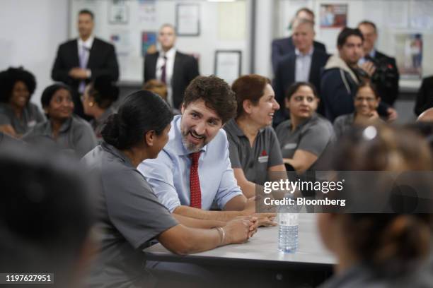 Justin Trudeau, Canada's prime minister, speaks with employees during an event at the ABC Technologies Inc. Facility in Brampton, Ontario, Canada, on...