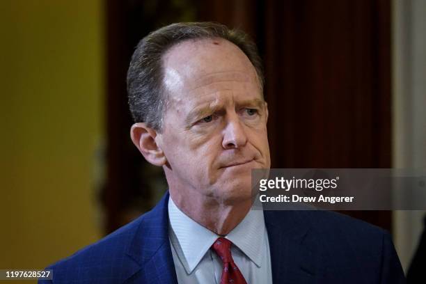 Sen. Pat Toomey leaves the Senate chamber during a recess in the Senate impeachment trial of U.S. President Donald Trump continues at the U.S....