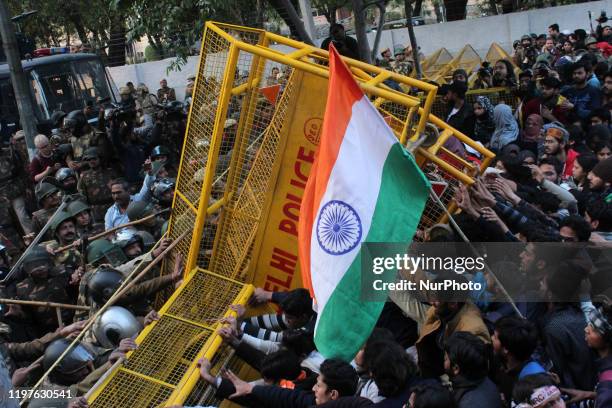 Students of Jamia Millia Islamia and local residents of Okhla during a protest against the controversial Citizenship Amendment Act , the National...