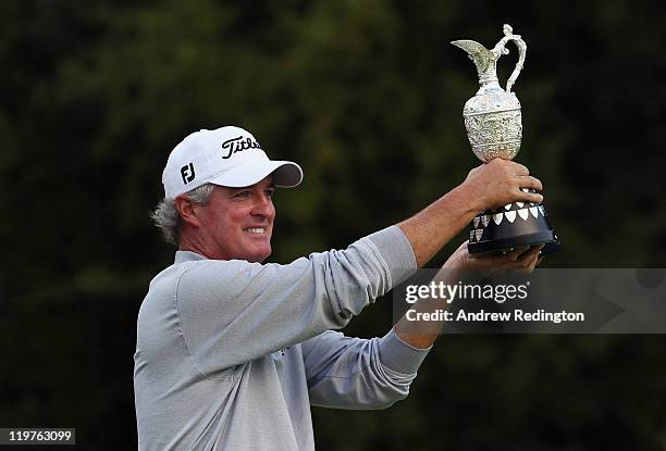 Russ Cochran of the USA poses with the trophy after winning the Senior Open Championship at Walton Heath Golf Club on July 24, 2011 in Tadworth,...