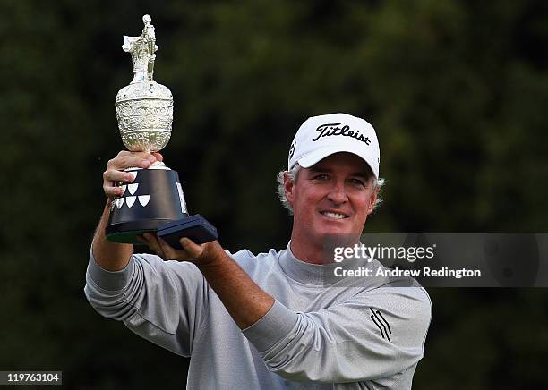 Russ Cochran of the USA poses with the trophy after winning the Senior Open Championship at Walton Heath Golf Club on July 24, 2011 in Tadworth,...