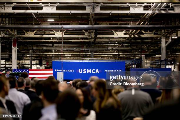 Banner reads "Promises Made, Promises Kept" and "USMCA" during a visit from U.S. President Donald Trump, not pictured, to a company's manufacturing...