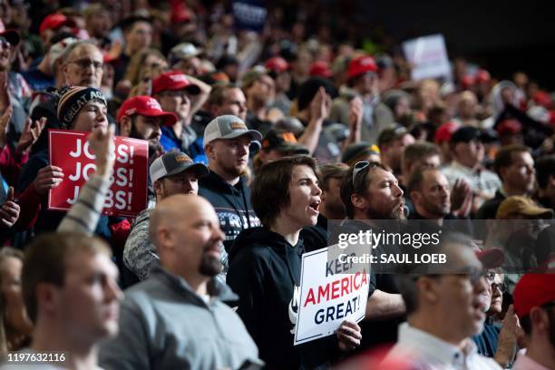 Supporters of US President Donald Trump cheer during a "Keep America Great" campaign rally at Drake University in Des Moines, Iowa, January 30, 2020.