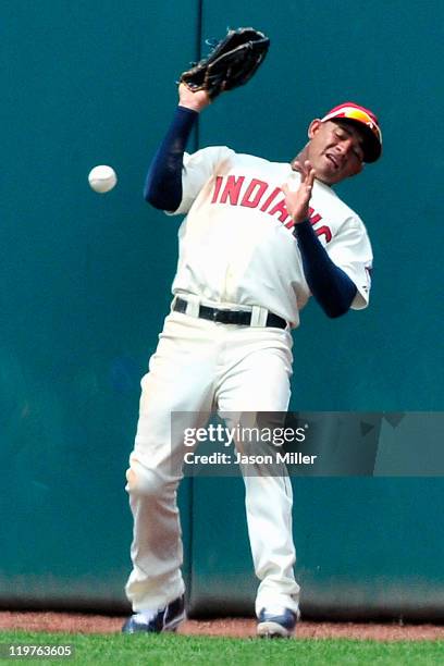 Center fielder Ezequiel Carrera of the Cleveland Indians drops a fly ball from Adam Dunn of the Chicago White Sox for a two RBI double during the...