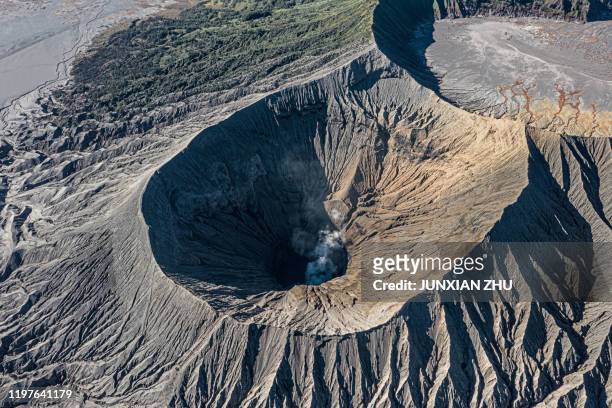 an aerial view of mount bromo volcano (gunung bromo) in east java indonesia. - bromo crater fotografías e imágenes de stock