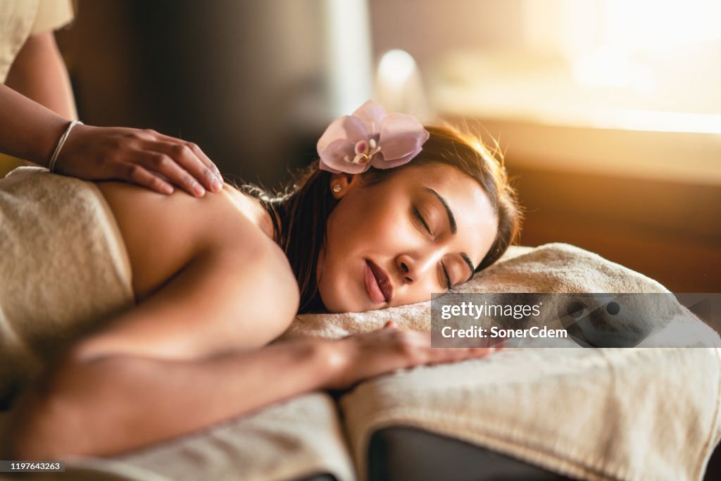 Happiness on woman's face having relaxing thai massage