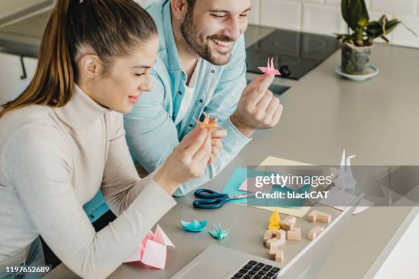 making origami - origami stock pictures, royalty-free photos & images