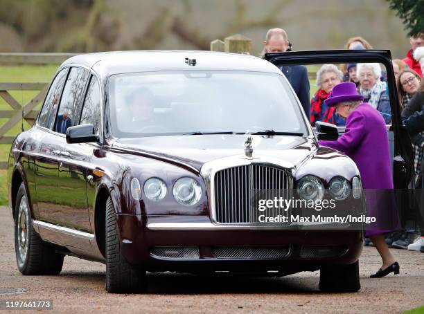 Queen Elizabeth II gets into her Bentley car after attending Sunday service at the Church of St Mary Magdalene on the Sandringham estate on January...