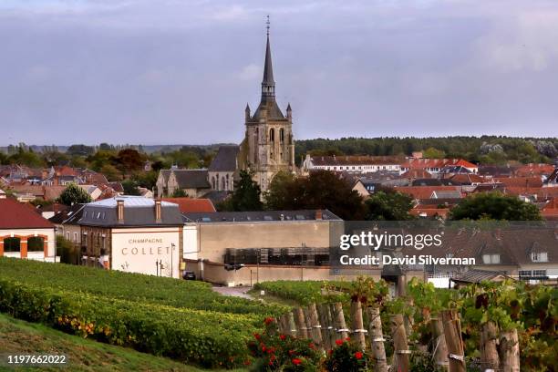 The 15th century Gothic style Église Saint-Brice d'Ay Catholic church dominates the skyline on October 4, 2019 of the village of Ay in the Vallée de...