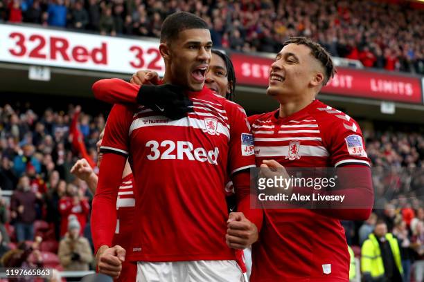 Ashley Fletcher of Middlesbrough celebrates with teammates after scoring his team's first goal during the FA Cup Third Round match between...