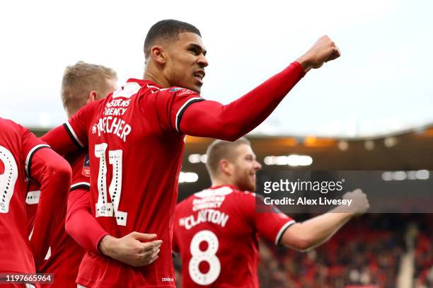 Ashley Fletcher of Middlesbrough celebrates with teammates after scoring his team's first goal during the FA Cup Third Round match between...