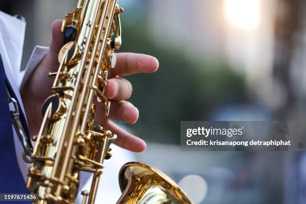 saxophone,international jazz day and world jazz festival. saxophone, music instrument played by saxophonist player musician in fest. - jazz music photos 個照片及圖片檔