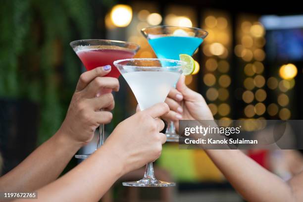 shot of a group of young friends hanging out and having drinks together - cocktail and mocktail bildbanksfoton och bilder