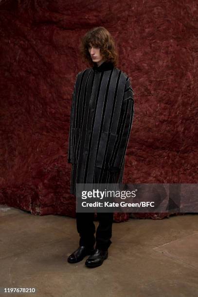 Model walks the runway at the Omar Afridi Presentation during London Fashion Week Men's January 2020 at the Dray Walk Gallery on January 05, 2020 in...