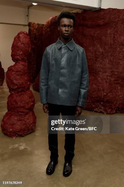 Model walks the runway at the Omar Afridi Presentation during London Fashion Week Men's January 2020 at the Dray Walk Gallery on January 05, 2020 in...