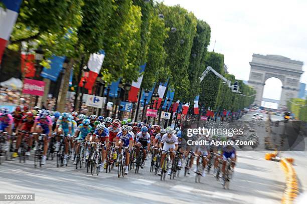 The peloton ride with the Arc de Triomphe on the horizon during Stage 21 of the Tour de France between Creteil to Paris Champs-Elysees on July 24,...