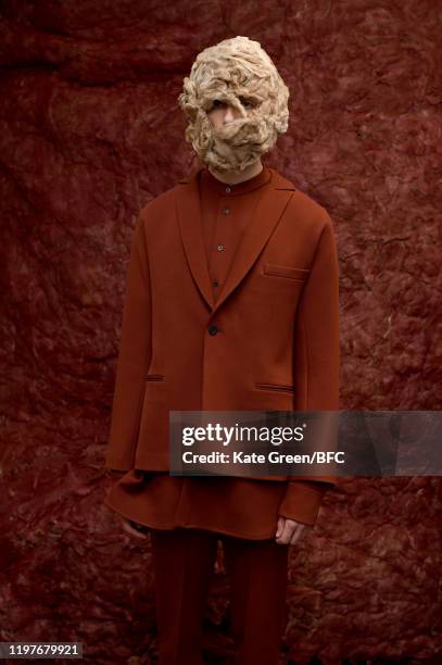 Model walks the runway at the Omar Afridi Presentation during London Fashion Week Men's January 2020 at the Dray Walk Gallery on January 05, 2020 in...